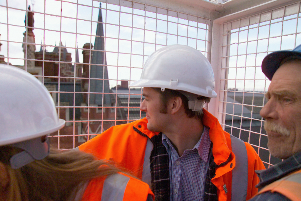 Site Managers In Lift Wearing High Vis